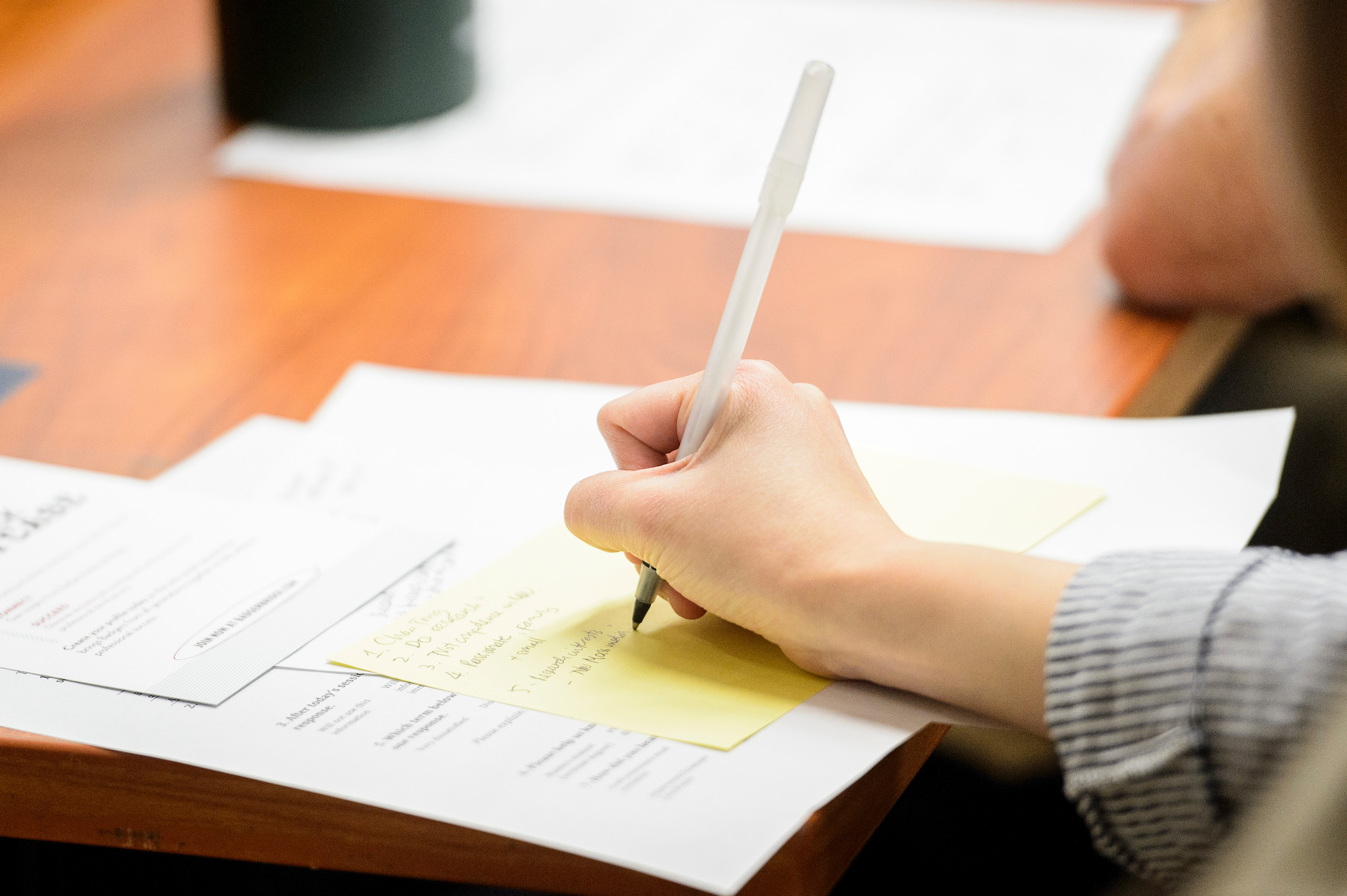 Right hand writing on a piece of paper